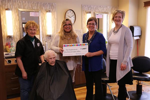 2016 Holiday Shears Larson presents the residents with check