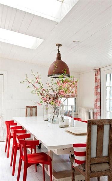 Add Red chairs to bring some unexpected cheer to your dining room table