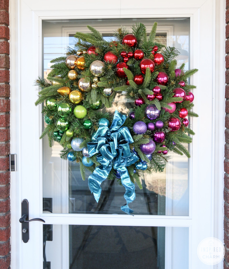 Add a bold and bight look to your front porch with the rainbow ornament wreath.